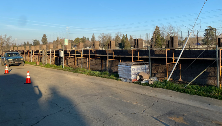 sound wall construction with small pickup truck